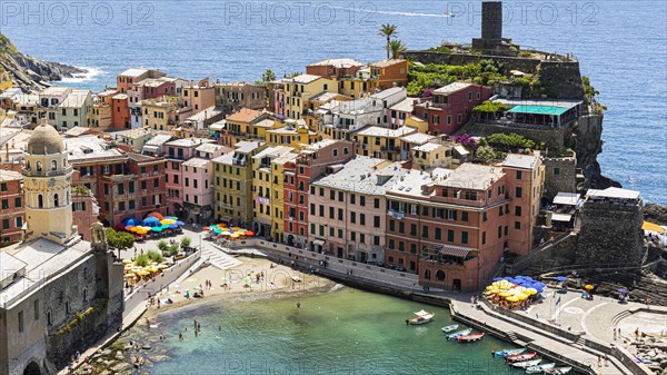 The village of Vernazza with its nested pastel-coloured houses built into the hillside