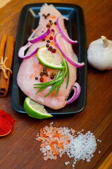 Fresh organic chicken breast with herbs and spices