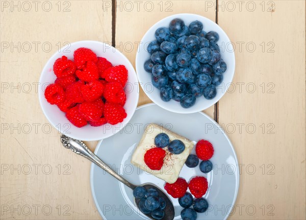 Fresh homemade raspberry and blueberry cream cake