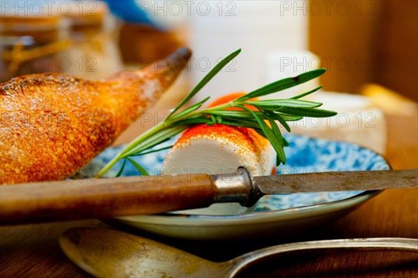 French cheese and fresh baguette on a wood cutter