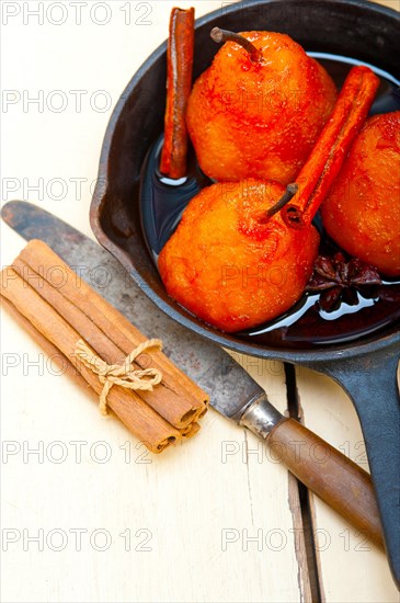 Poached pears delicious home made recipe ove white rustic wood table