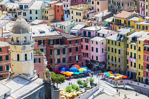 The village of Vernazza with its nested pastel-coloured houses built into the hillside