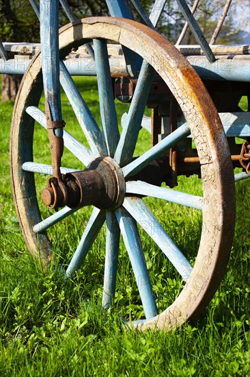 Wooden wheel on an old wooden cart