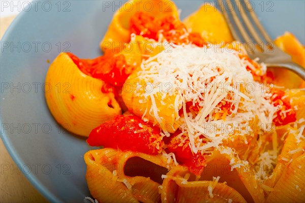 Italian snail lumaconi pasta with ripe cherry tomatoes sauce ingredients