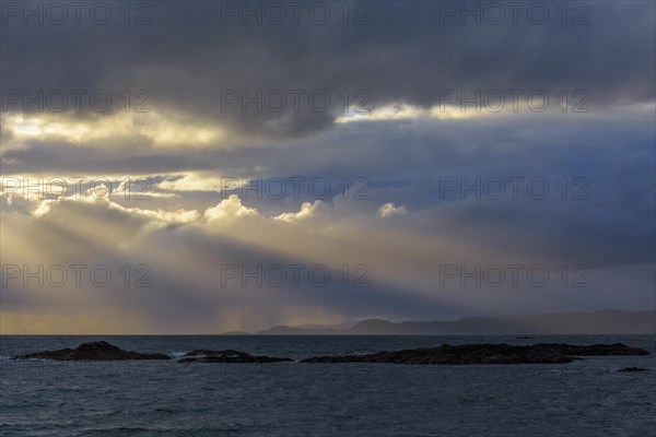 Scottish coast at sunset with sunrays