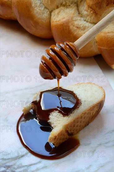 Yacon syrup drips onto a slice of yacon