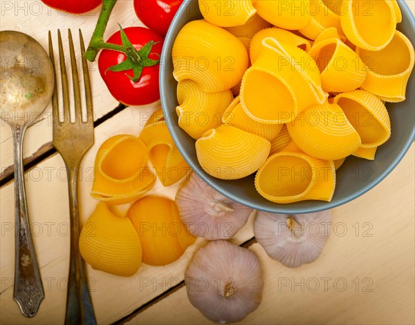 Italian snail lumaconi pasta with ripe cherry tomatoes sauce ingredients