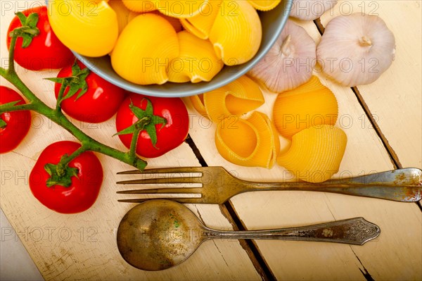 Italian snail lumaconi pasta with ripe cherry tomatoes sauce ingredients