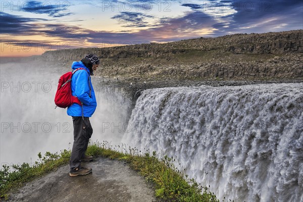 Hiker at the edge of Dettifoss