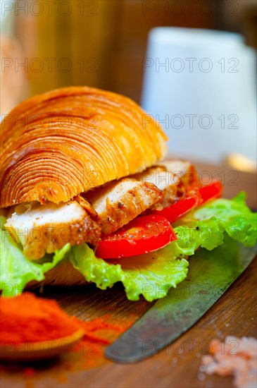 Savory croissant brioche bread with chicken breast and vegetable rustic style