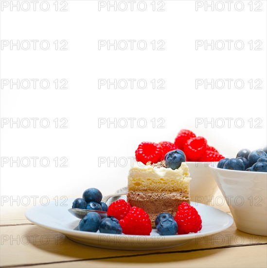 Fresh homemade raspberry and blueberry cream cake