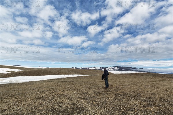 Tourist on stony plateau