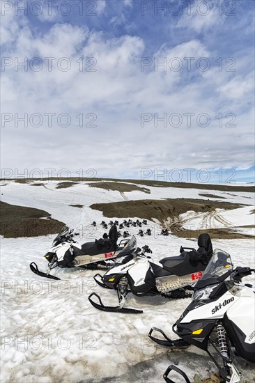 Snowmobiles in rows