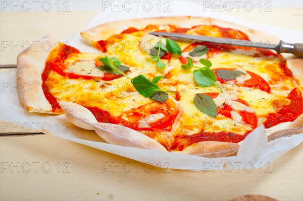 Italian traditional pizza Margherita tomato mozzarella and basil