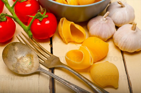 Italian snail lumaconi pasta with ripe cherry tomatoes sauce ingredients