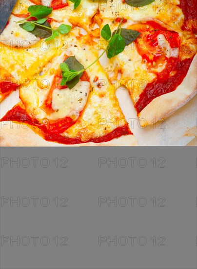 Italian traditional pizza Margherita tomato mozzarella and basil