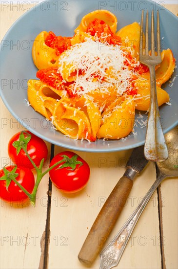 Italian snail lumaconi pasta with ripe cherry tomatoes sauce ingredients