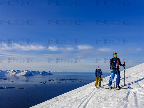 Two ski tourers on the ascent above Bergsfjord