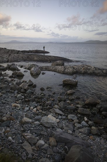 Man fishing along Wild Atlantic way at Renvyle. County Galway