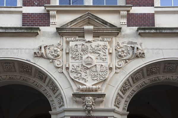 Old city coat of arms of Goerlitz above the entrance portal of the primary school