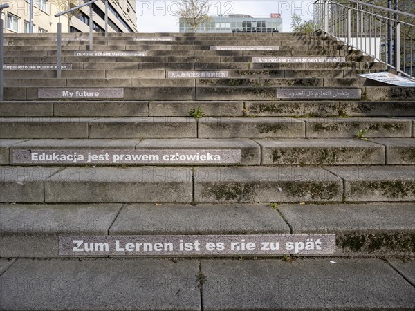 Stairway steps with slogans on the subject of education in several languages