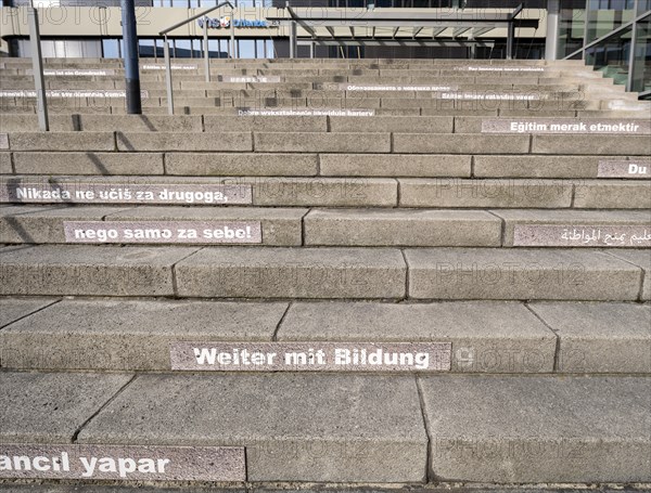 Stairway steps with slogans on the subject of education in several languages