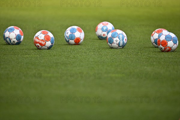 Adidas Derbystar match balls lie on grass