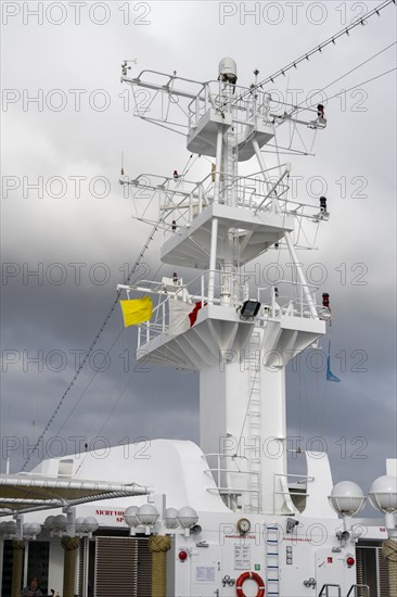 Cruise ship with yellow flag