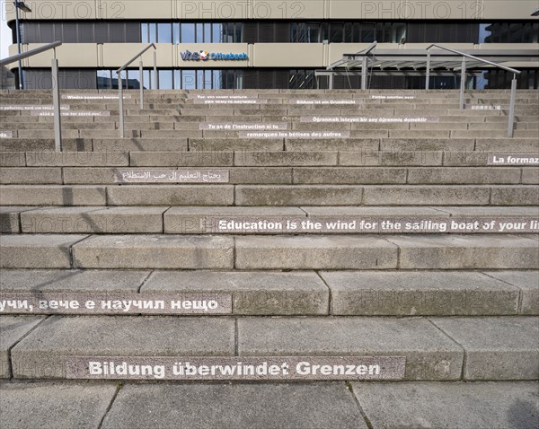 Stairway steps with slogans on the subject of education in several languages