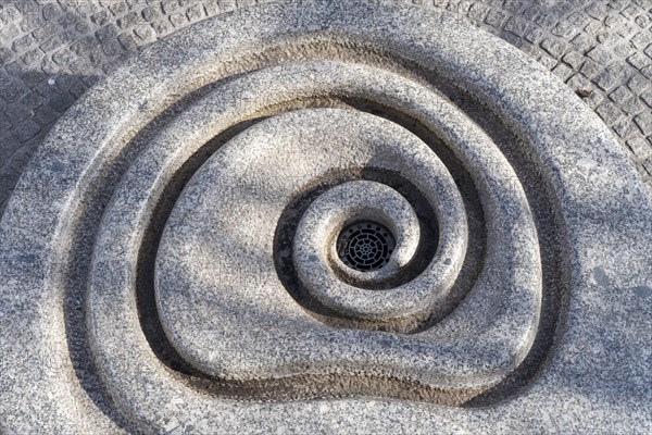 Auger-shaped water drain in the old town