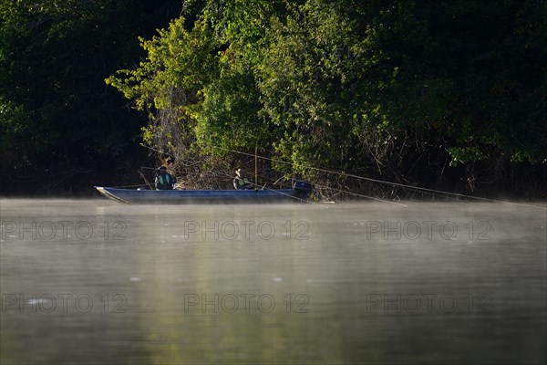 Two anglers in a boat on the Rio Sao Lourenco