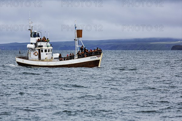 Former fishing boat with tourists