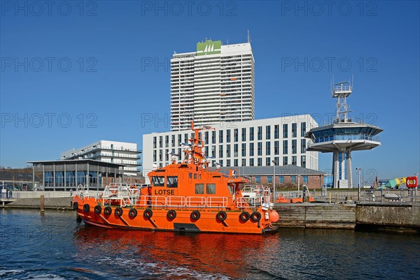 Pilot boat in front of the Hotel Maritim and Hotel Aja