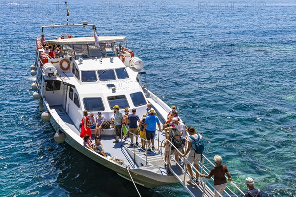 Tourists embark on the liner at Cinque Terre