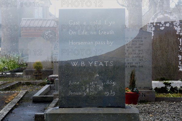 Double exposure of W. B. Yeats gravestone at Drumcliff graveyard underneath Ben Bulben mountain. Sligo