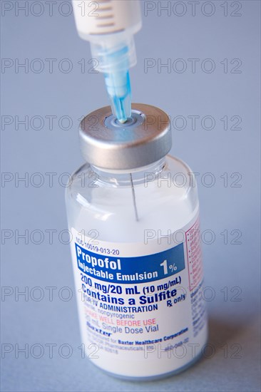 Propofol medical vial with inserted syringe