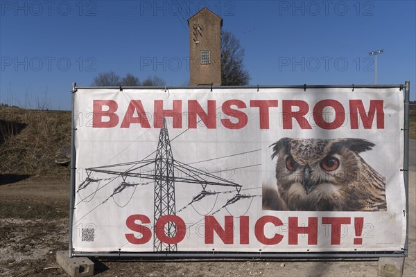 Action poster against electricity pylons