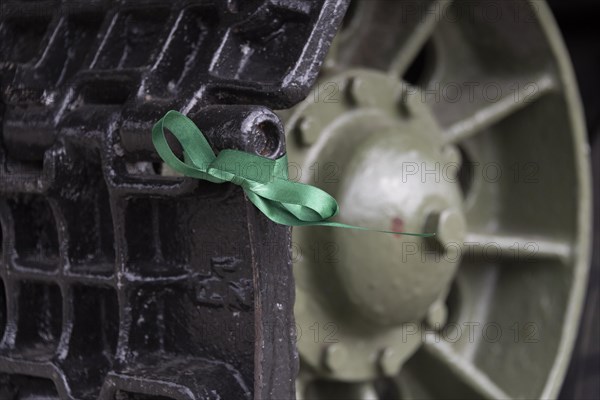 Green ribbon on a tank chain