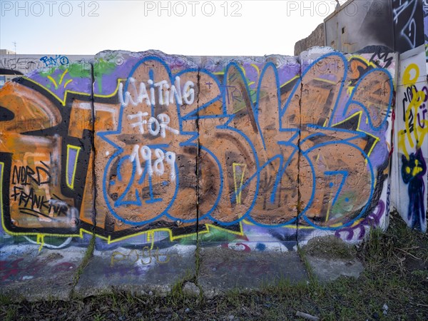 Graffiti on wall remains behind the Urban Gardening project at a new development area at the Old Harbour