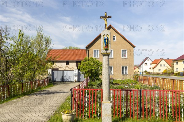 Wayside shrine in front of a residential house