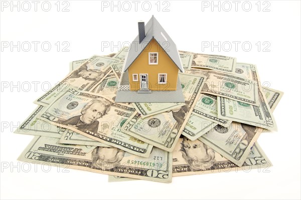 Home and money isolated on a white background