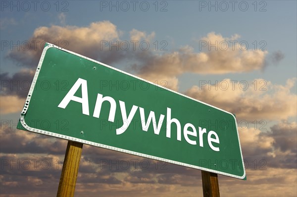 Anywhere green road sign with dramatic clouds and sky