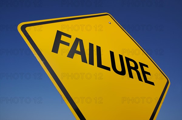 Yellow failure road sign against A dramatic blue sky with clipping path