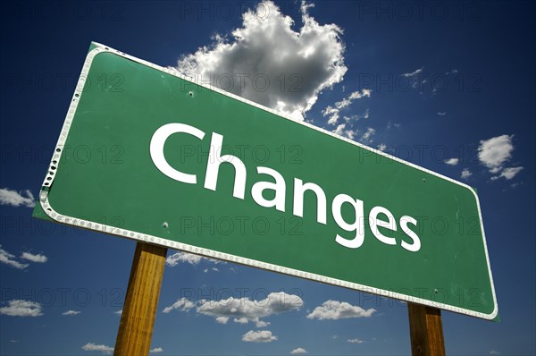 Changes road sign with dramatic blue sky and clouds