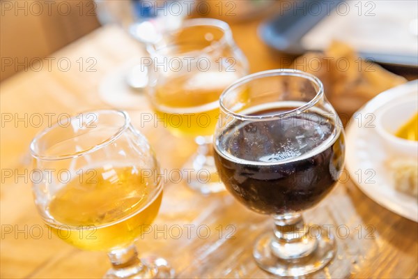 Abstract of small glass of micro brew beers on bar