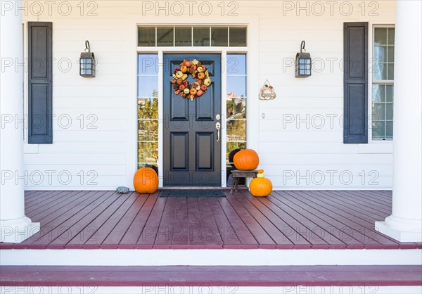 Fall decoration adorns beautiful entry way to home
