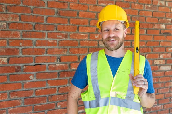 Caucasian male contractor with hard hat