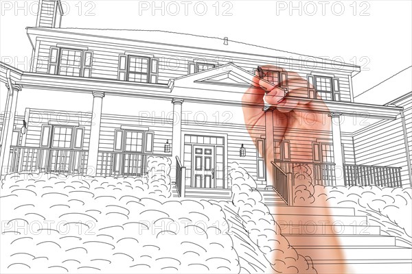 Male hand sketching with pencil the outline of a beautiful house on white