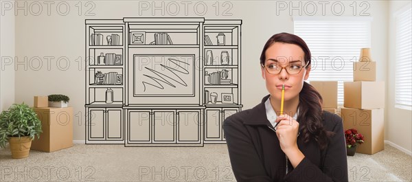 Woman inside room with moving boxes glancing toward entertainment unit drawing on wall