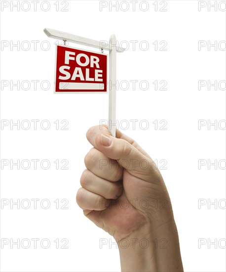 For sale real estate sign in male fist isolated on a white background